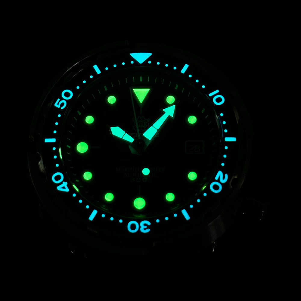 STEELDIVE SD1975K lume shot with hands, markers and bezel glowing green and blue in the dark