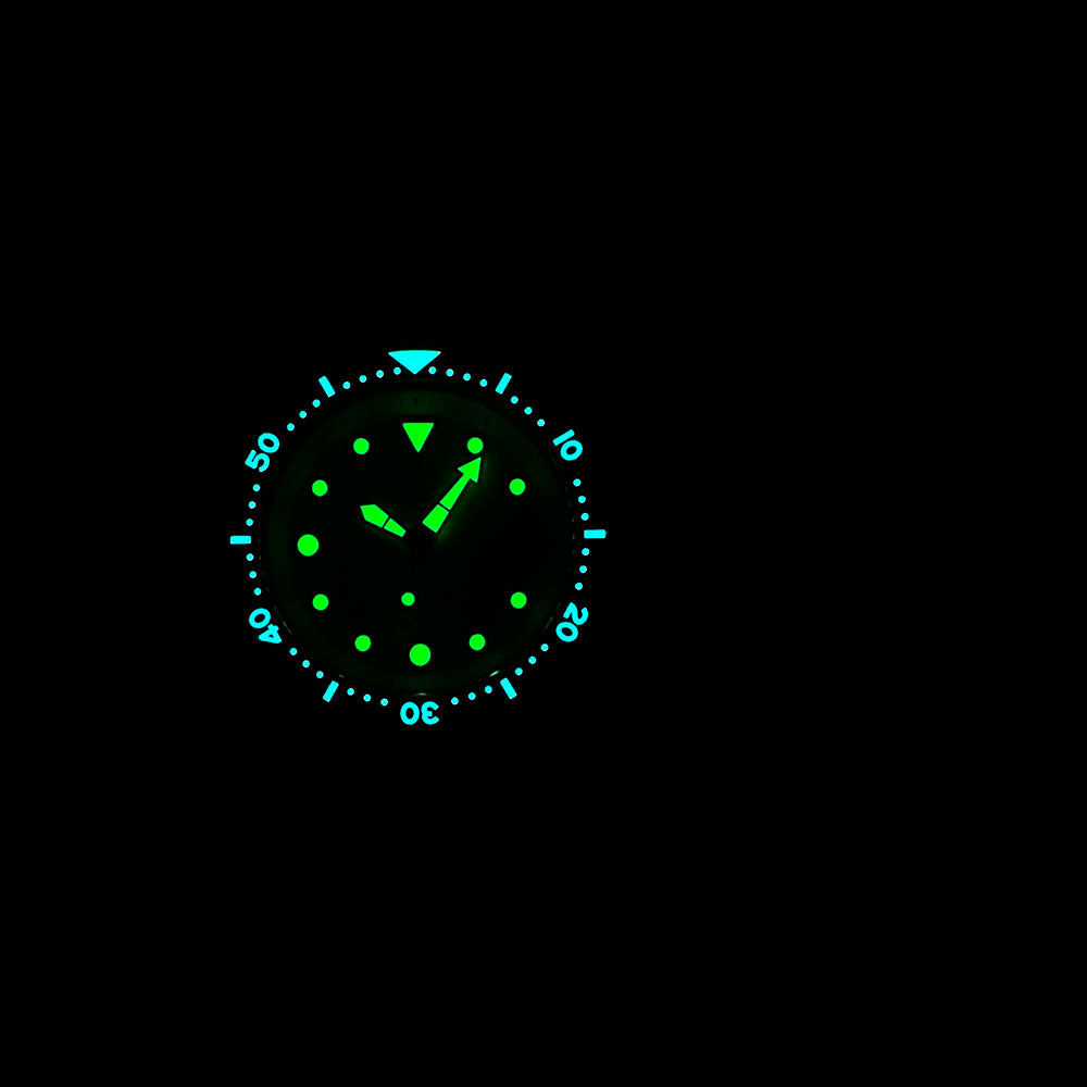 STEELDIVE SD1975N lume shot from a distance with dial and bezel glowing in the dark