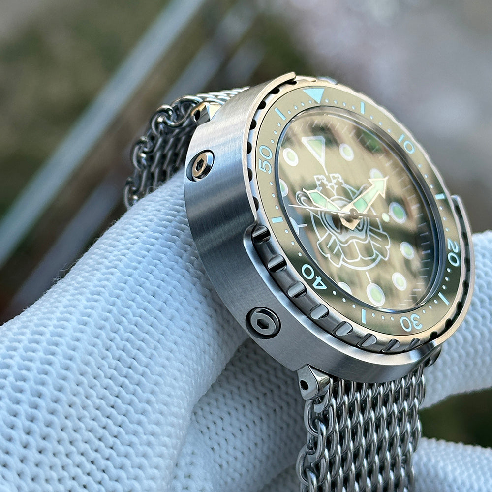 Steeldive SD1975P tuna watch green dial three-quarter view showing bezel coin edge and mesh bracelet