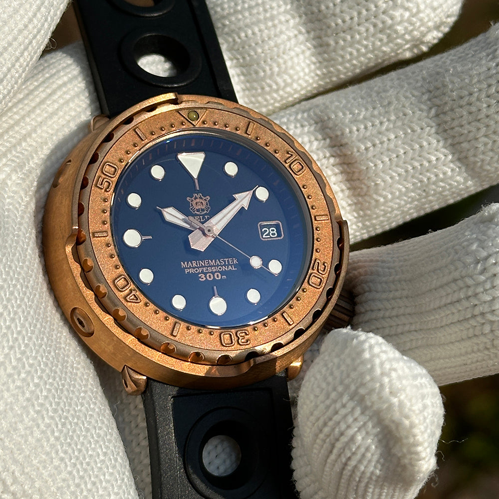 Steeldive SD1975S V1 bronze dive watch blue dial macro with sword hands and 300m depth rating