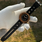 Steeldive SD1975S V1 bronze diver resting on white glove with full black perforated rubber strap shown