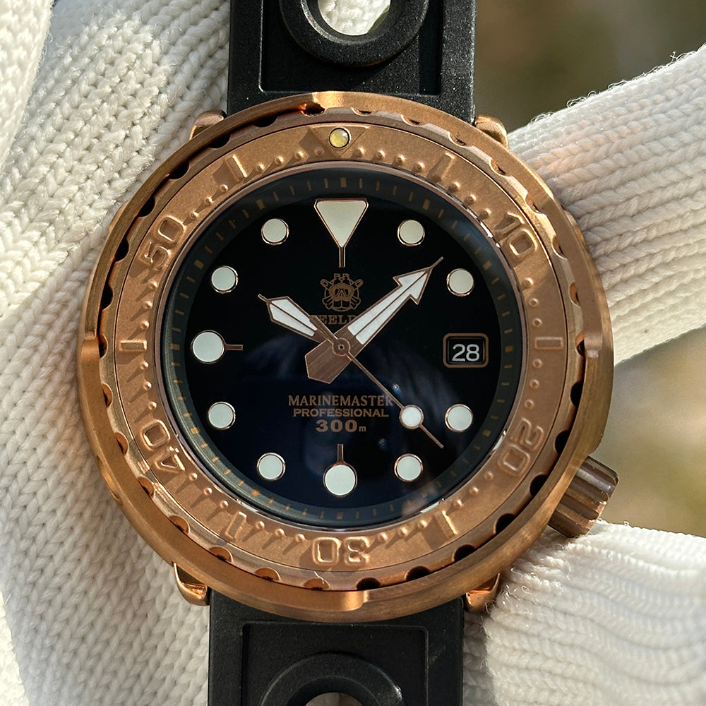 Steeldive SD1975S V1 bronze tuna black dial macro showing MARINEMASTER 300m text and date