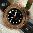 Steeldive SD1975S V1 solid bronze 300m dive watch in warm sunlight showing patina-ready bronze tone