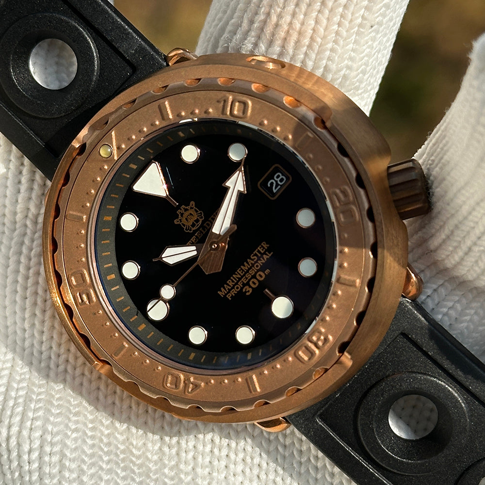 Steeldive SD1975S V1 solid bronze 300m dive watch in warm sunlight showing patina-ready bronze tone