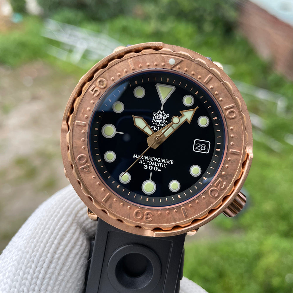 Steeldive SD1975S V2 bronze dive watch front three quarter angle with black rubber strap outdoors