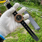 Steeldive SD1975S V2 bronze tuna dive watch on hand displaying full black rubber strap and bronze case
