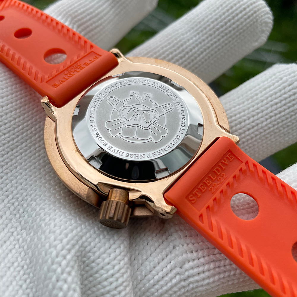Steeldive SD1975S V2 bronze dive watch caseback engraved diver logo and NH35 300M markings, orange strap