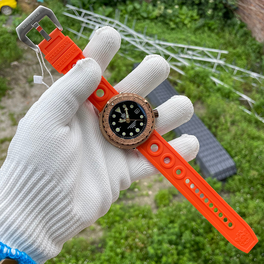 Steeldive SD1975S V2 bronze tuna dive watch on hand showing full orange perforated rubber strap