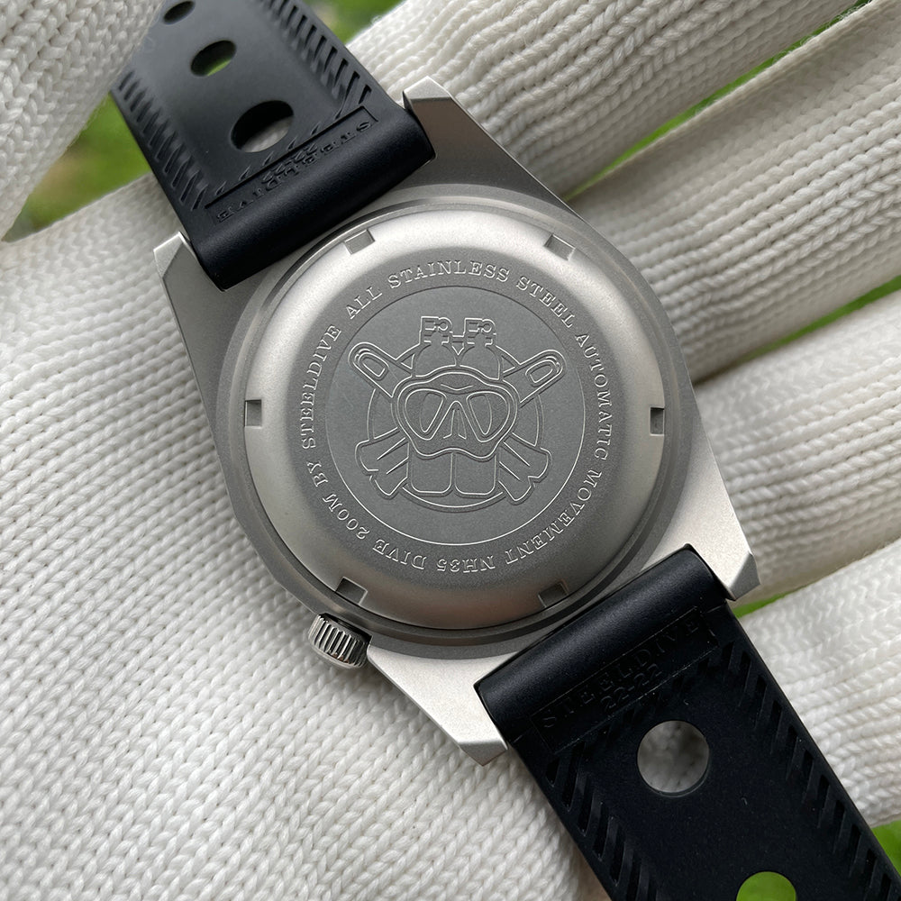 Steeldive SD1979 stainless steel caseback engraved with diver helmet logo and NH35 200M
