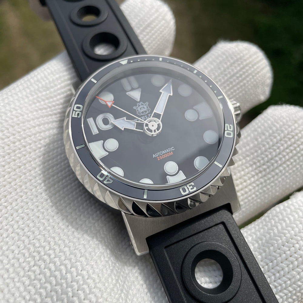 Steeldive SD1982 close-up of coin-edge ceramic bezel insert and black dial with sword hands