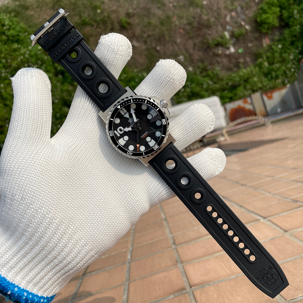 Steeldive SD1982 black perforated rubber strap stretched out showing branding and buckle