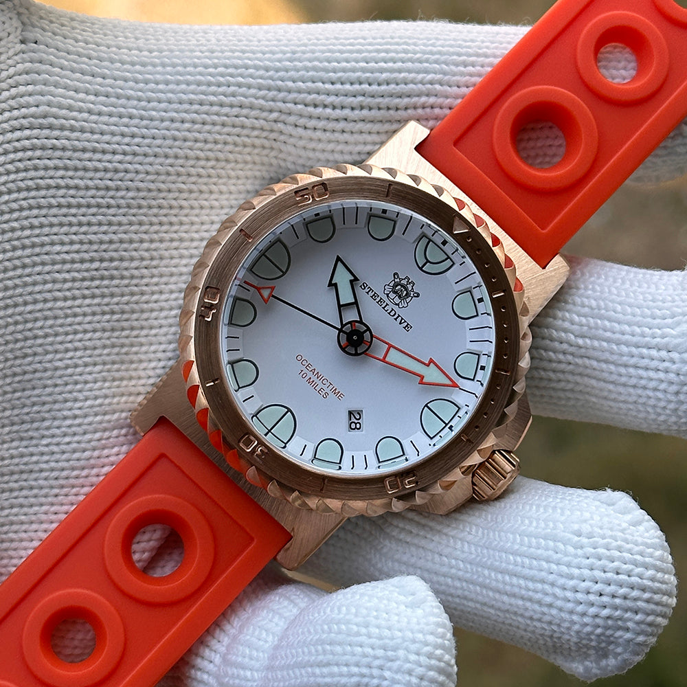 Steeldive SD1982S bronze dive watch crown and case detail with orange strap, crown detail