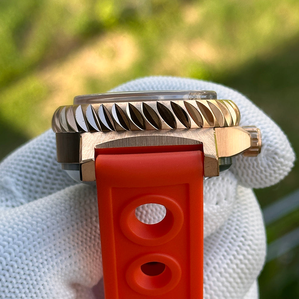 Steeldive SD1982S bronze dive watch side profile with orange rubber strap and toothed bronze bezel