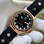 Steeldive SD1982S bronze case dial macro showing applied lume markers, arrow hands and date window