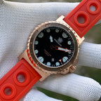 Steeldive SD1982S bronze dive watch with orange rubber strap, three-quarter angle close-up