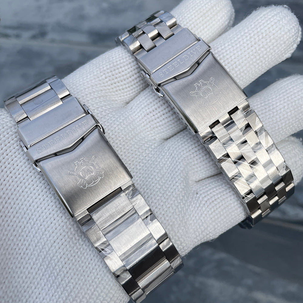 Steeldive SD1983 oyster and jubilee bracelet clasps side by side with engraved Steeldive diver logo
