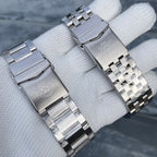 Steeldive SD1983 oyster and jubilee bracelet clasps side by side with engraved Steeldive diver logo