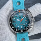 Steeldive SD1983 ceramic dive watch on cyan rubber strap, three-quarter view of ice blue dial and case