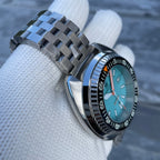 Steeldive SD1983 ceramic dive watch on jubilee steel bracelet, three-quarter wrist hold with ice blue dial