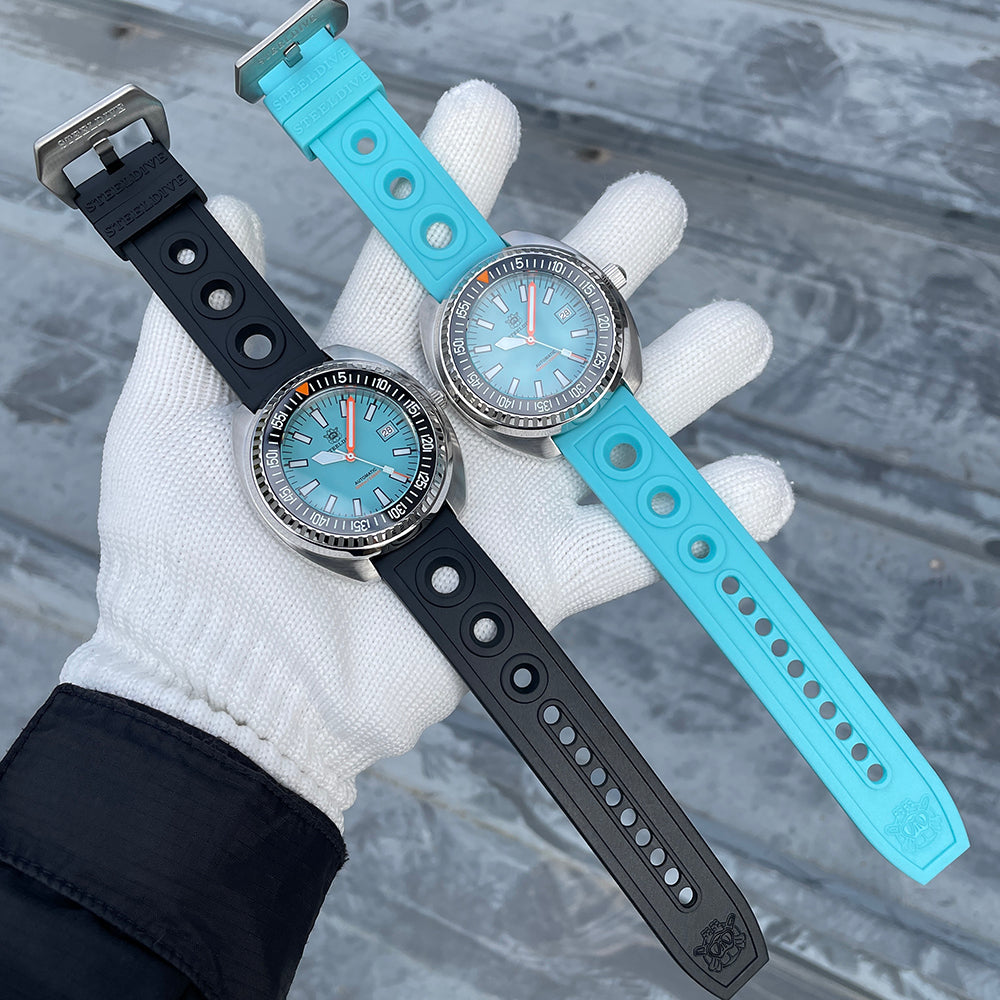 Steeldive SD1983 ceramic dive watches on black and cyan perforated rubber dive straps, held side by side
