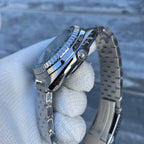 Steeldive SD1983 ceramic case side profile with signed screw-down crown and polished bevels, gloved hold