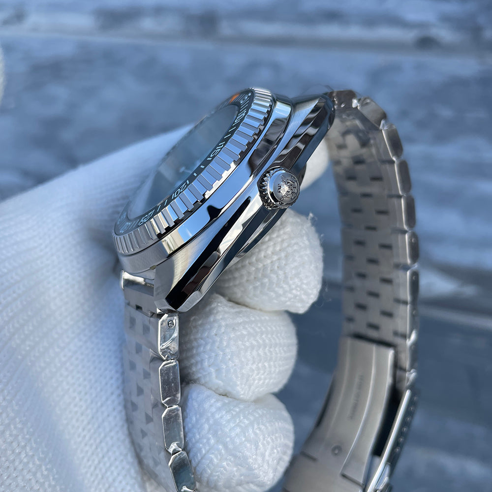 Steeldive SD1983 ceramic case side profile with signed screw-down crown and polished bevels, gloved hold