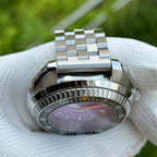 Steeldive SD1983 purple dial dive watch coin-edge bezel and jubilee bracelet detail, side angle