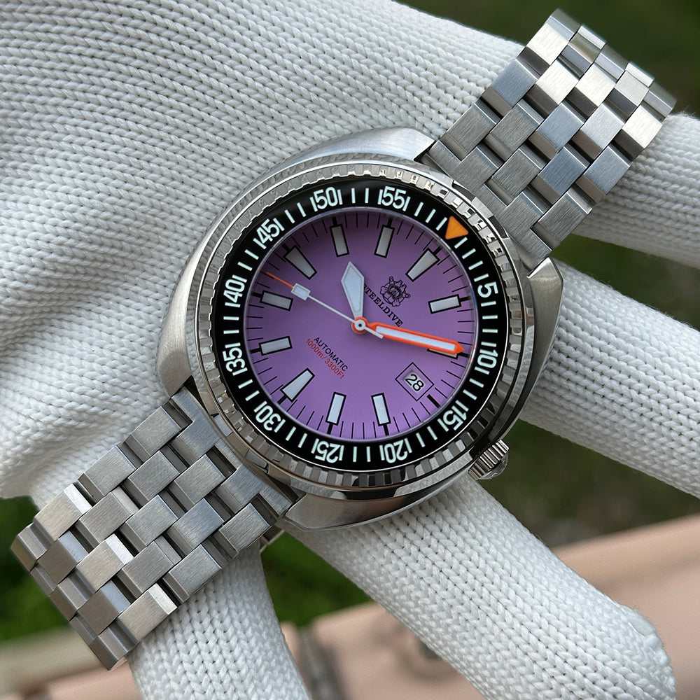 Steeldive SD1983 purple dial dive watch on jubilee bracelet styled on white cloth lifestyle shot