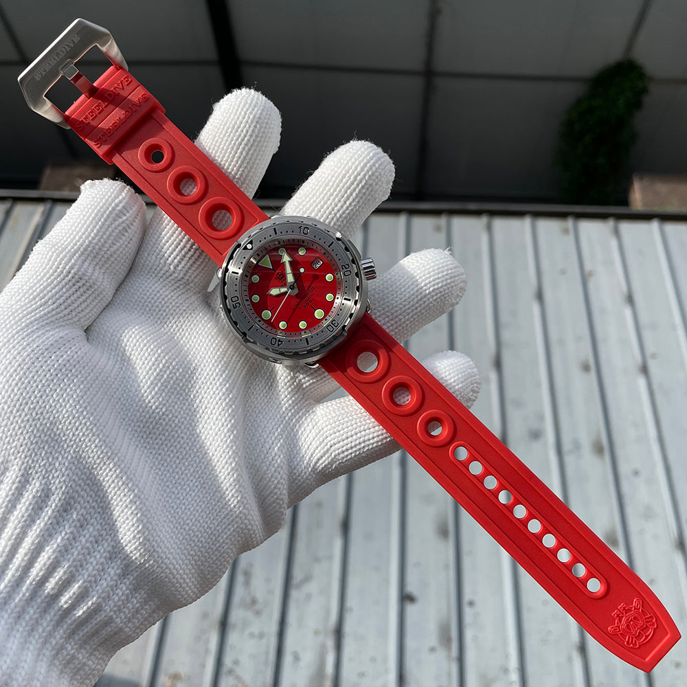 Steeldive SD1986 tuna watch red dial on red rubber strap held in hand, strap detail