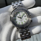 Steeldive SD1986 tuna watch white dial steel bracelet held in hand, lifestyle angle