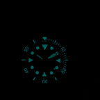 Steeldive SD1987 diver BGW9 lume shot glowing blue-green in darkness on black dial