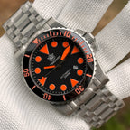 Steeldive SD1987 steel bracelet paired with orange-dial 2000M diver watch, front pairing shot
