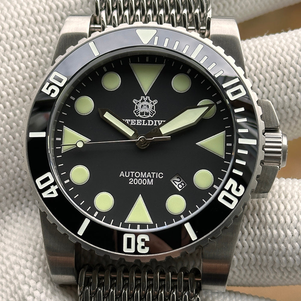 Steeldive SD1987 dive watch black dial C3 lume on shark mesh bracelet, front close-up