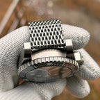 Steeldive SD1987 caseback edge with engraved bezel and shark mesh bracelet underside