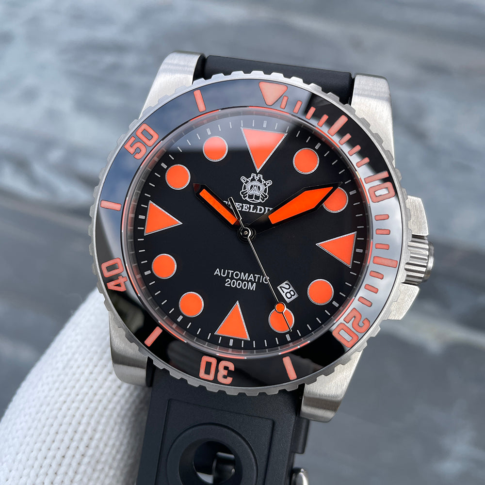 Steeldive SD1987 orange-accented diver on black perforated rubber strap, front three-quarter view