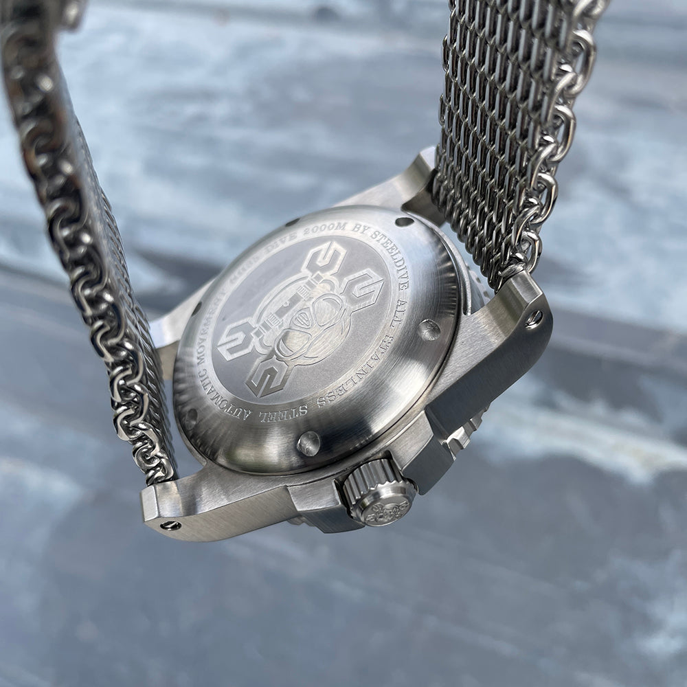 Steeldive SD1987 engraved caseback with 2000m diver helmet logo on stainless mesh bracelet