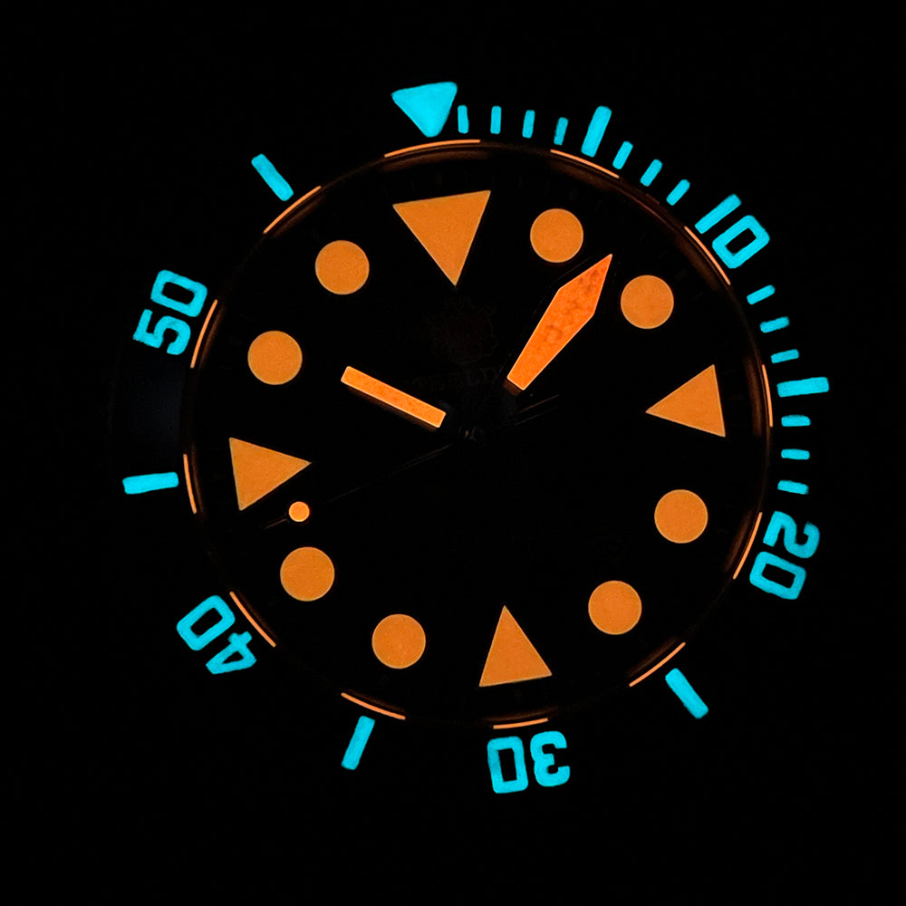 Steeldive SD1987 dial and bezel glowing in the dark with blue and orange Super-LumiNova