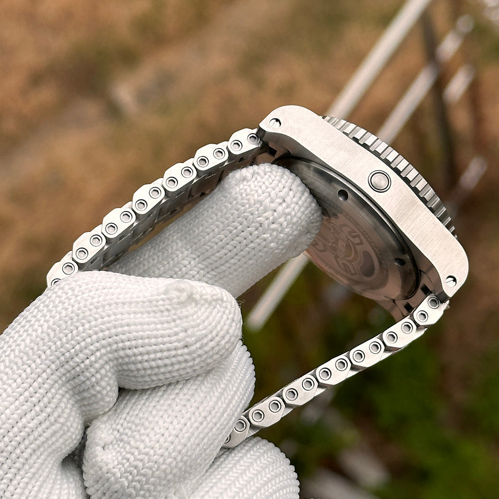 Steeldive SD1987 angled rear view showing engraved caseback and tank bracelet curvature