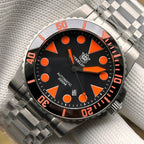 Steeldive SD1987 orange dial macro highlighting bezel numerals, orange indices and steel tank bracelet