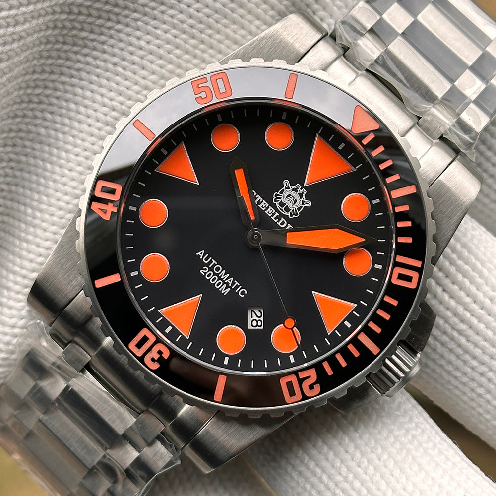 Steeldive SD1987 orange dial macro highlighting bezel numerals, orange indices and steel tank bracelet