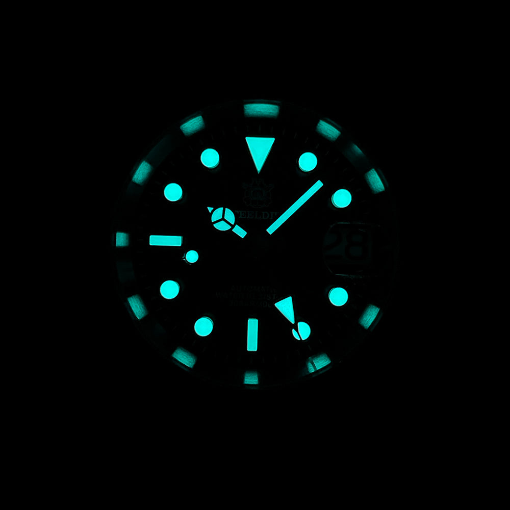 Steeldive SD1992 GMT dive watch lume shot showing blue C3 lume on indices and hands in the dark