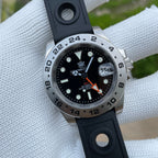 Steeldive SD1992 GMT dive watch with black dial and black rubber strap angled to show 24-hour bezel