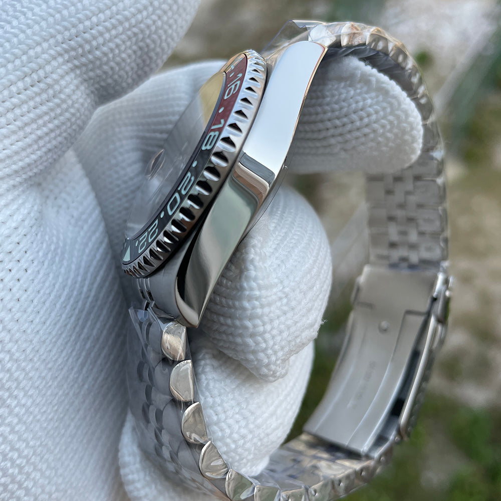 Steeldive SD1993 GMT watch side view showing bi-directional ceramic GMT bezel edge and polished case, gloved hand