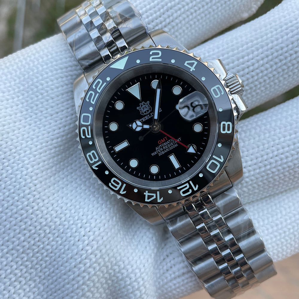 Steeldive SD1993 GMT watch black dial with black ceramic bezel and jubilee bracelet, dial macro on pillow