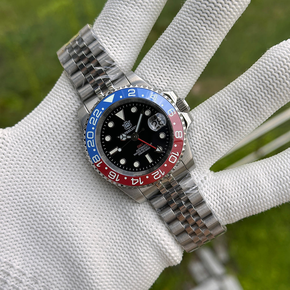 Steeldive SD1993 GMT watch with blue and red Pepsi ceramic bezel on jubilee bracelet, wrist shot on gloved hand