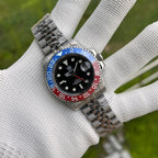 Steeldive SD1993 GMT watch with blue and red Pepsi ceramic bezel on jubilee bracelet, wrist shot on gloved hand