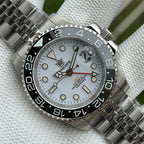 Steeldive SD1993 GMT dial macro with white face, applied indices and red GMT hand, black bezel