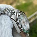 Steeldive SD1993 GMT side profile showing jubilee bracelet and black-green Sprite ceramic bezel