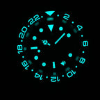 Steeldive SD1993 GMT watch lume shot showing cyan glow on indices, hands and bezel triangle