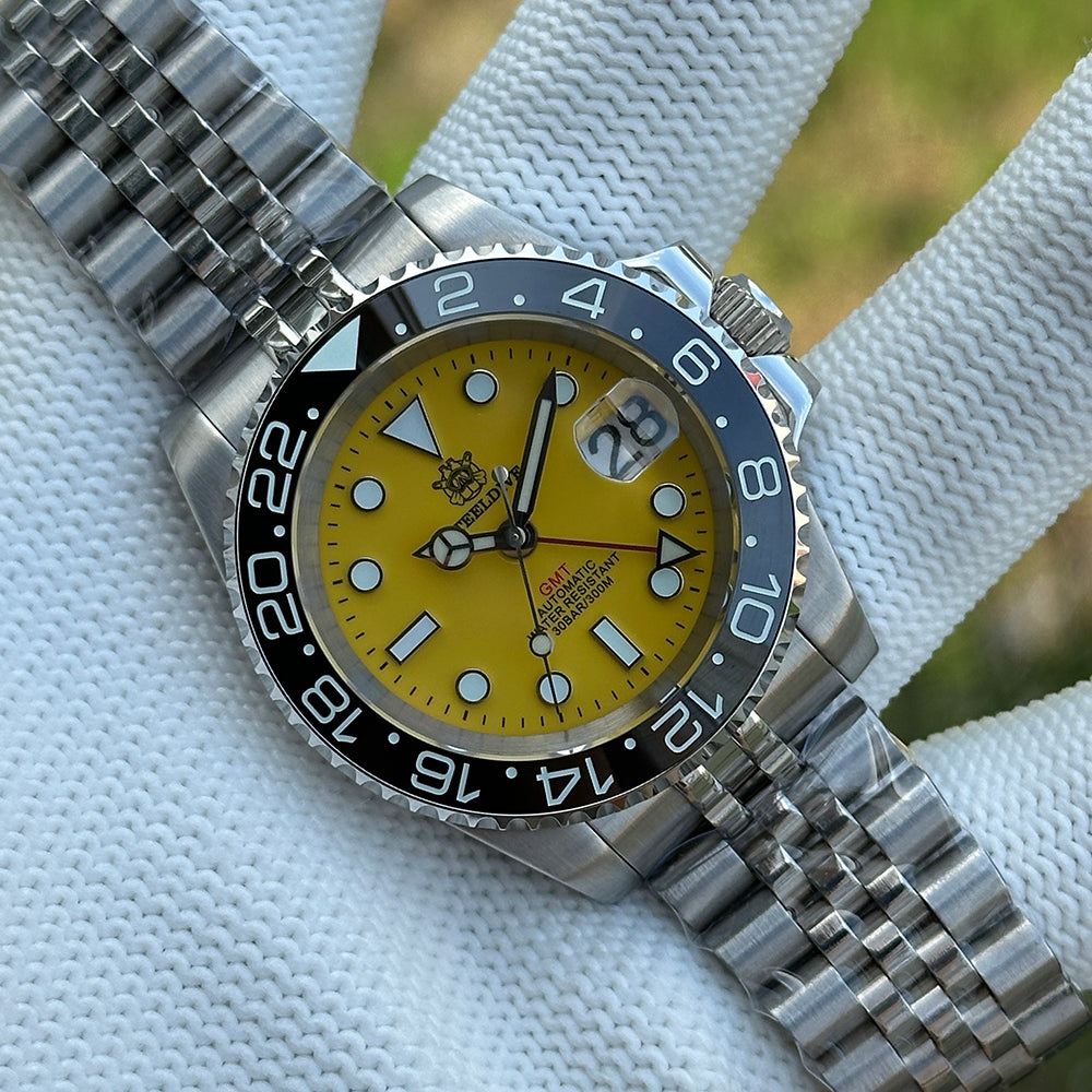 Steeldive SD1993 GMT dive watch with yellow dial and black ceramic bezel, jubilee bracelet front view